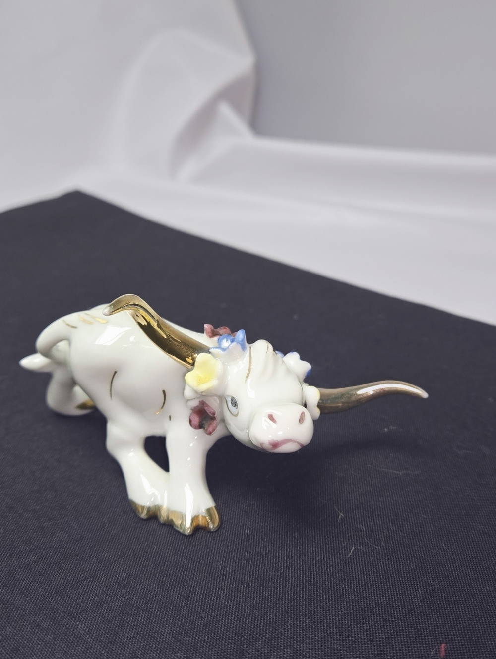 White Porcelain Bull Figurine with Gold Accents and Multicolor Flowers